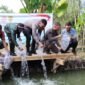 Polres Nganjuk Gelar Kegiatan Penanaman Pohon, Penyebaran Benih Ikan, dan Pemberian Beasiswa