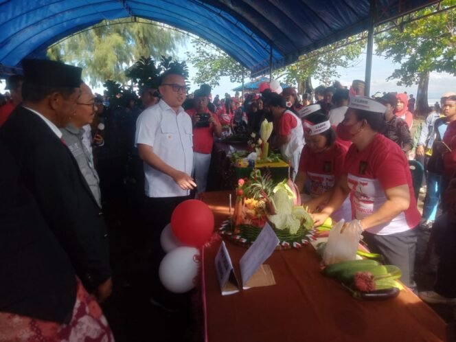 
Peringati HUT RI ke 80 Bendera Merah Putih Dipancang 80 Meter Di Pantai  Pariwisata Desa Ungkea Kecamatan Petasia Timur