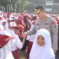 Kapolres Nganjuk Hadiri Apel Akbar KNC 2025, Ribuan Pelajar Nganjuk Terima Beasiswa