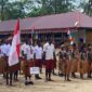 Antusiasme Tinggi Warnai Upacara Hardiknas di SD Naena Kekwa Bersama Satgas TMMD Kodim 1710/Mimika